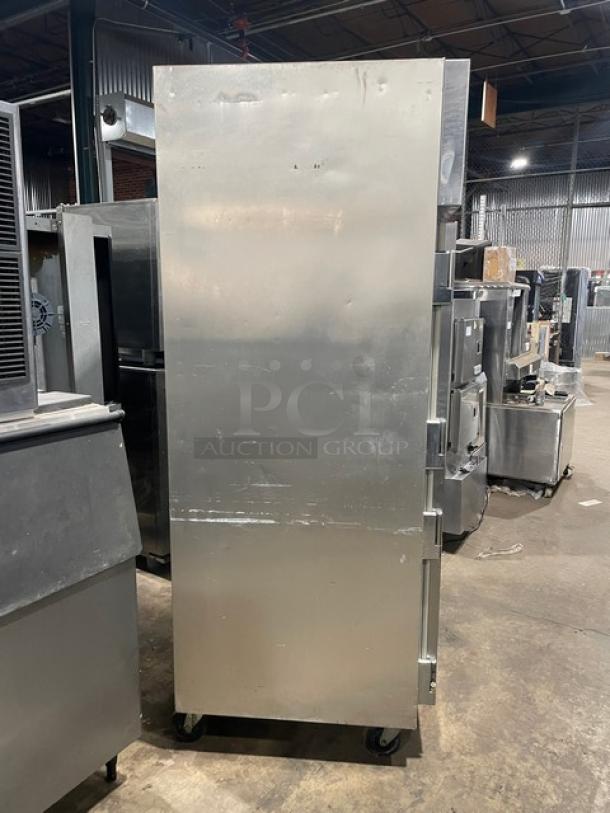 True STG2R commercial 2-door stainless steel refrigerator, Energy Star certified, on casters, poly coated racks, model SN: 8689302.