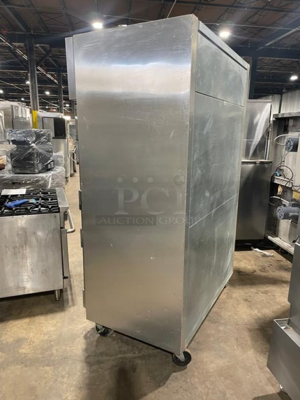 True STG2R commercial stainless steel 2-door refrigerator, Energy Star certified, poly coated racks, on casters, side view.
