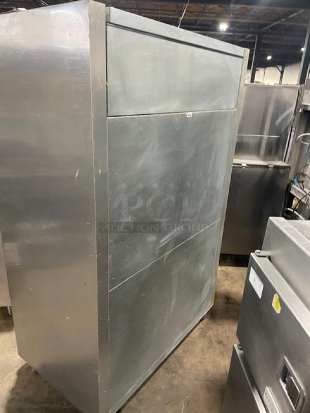 True commercial stainless steel 2-door reach-in refrigerator, model STG2R, on casters. Includes poly coated wired racks.