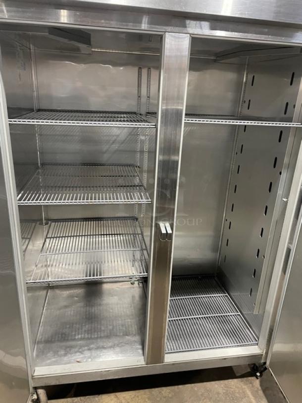 True STG2R stainless steel 2-door reach-in refrigerator with poly-coated wire racks, Energy Star certified, on casters.