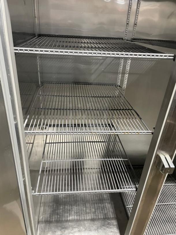 True STG2R stainless steel 2-door refrigerator with poly coated racks, Energy Star certified, on casters, in great condition.