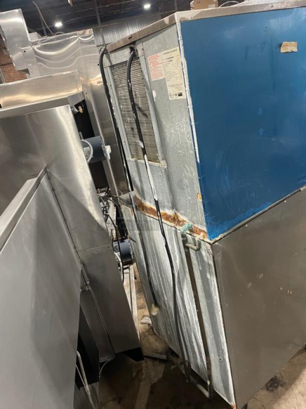 Hoshizaki KM-515MAH ice machine, stainless steel, air-cooled, 115-120V, visible wear, on legs. Model and serial labels visible.