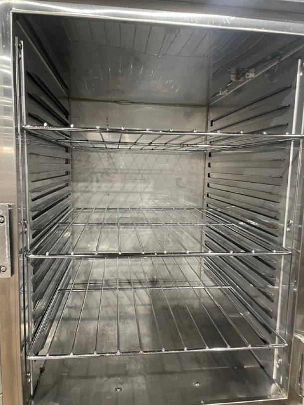 Alto-Shaam 1200-UP/SR stainless steel heated holding cabinet, dual compartments, chrome racks, Dutch door, on casters.