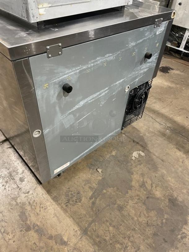 Turbo Air J Series undercounter refrigerator, model JUR-36, stainless steel, on casters, 115V, visible wear on surface.