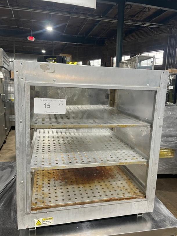 HeatMax commercial stainless steel countertop pizza/food warmer display case on legs, with three shelves, used condition.