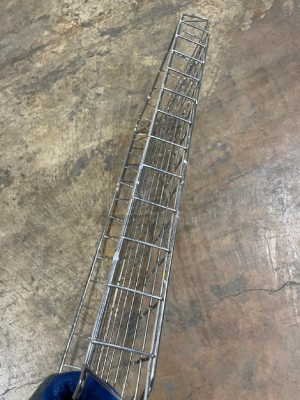 Chrome-plated steel stackable rectangular wired food storage basket, open-air style, in good condition.