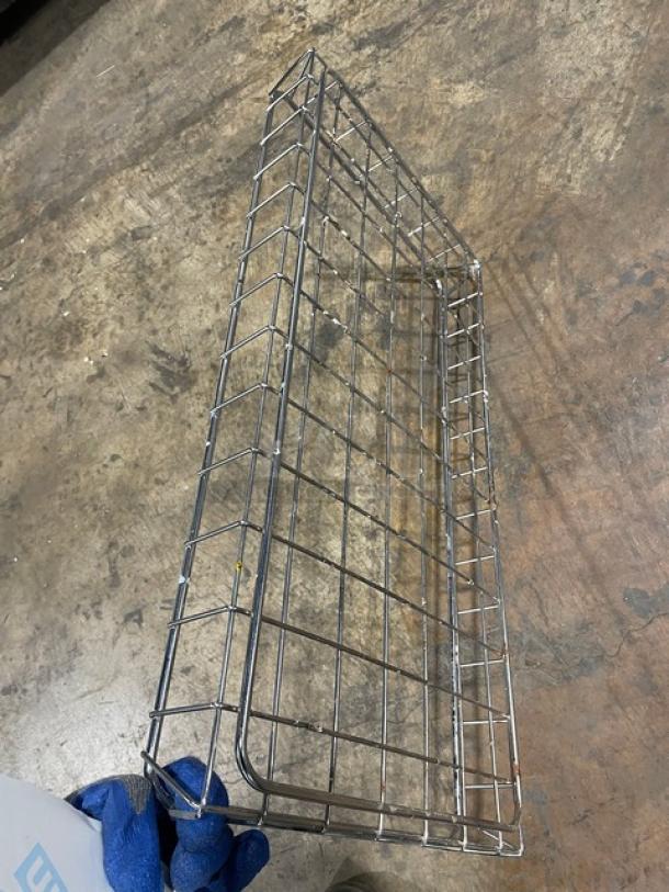 Commercial chrome-plated steel open-air stackable rectangular wired food storage basket in good condition.