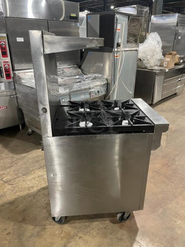 Southbend S241E commercial stainless steel 4-burner range/oven combo with overhead salamander shelf, backsplash, and casters.