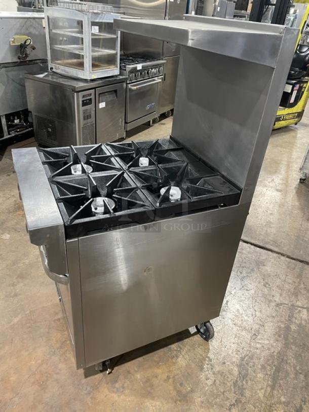 Southbend S241E stainless steel 4-burner range/oven combo with overhead salamander shelf, backsplash, and casters.