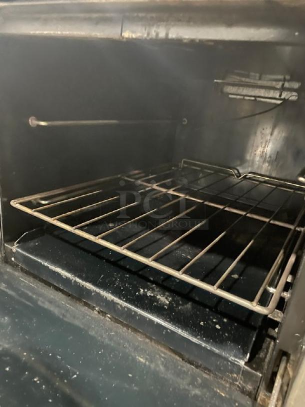 Southbend S241E commercial stainless steel oven interior with wired rack. Visible wear, on casters. Model: S241E SN: 19H17274.