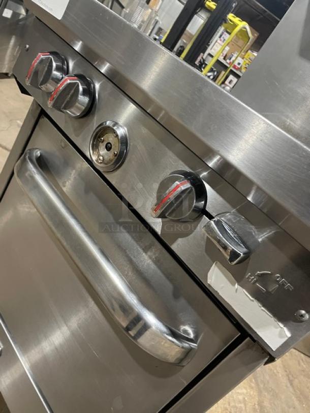 Southbend S241E stainless steel 4-burner range/oven combo with salamander shelf, backsplash, and wired oven rack. On casters.