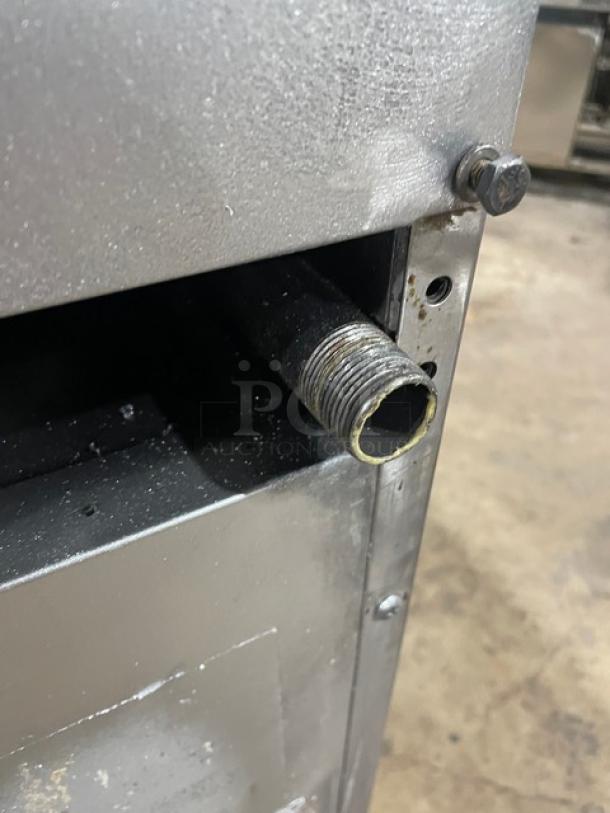 Southbend stainless steel 4-burner range/oven combo, Model S241E, SN 19H17274, on casters, with overhead salamander shelf and wired oven rack.