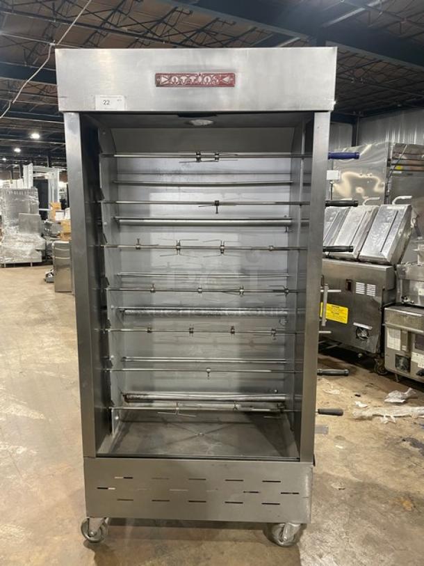Attias commercial stainless steel gas-powered full-height rotisserie cabinet on casters, featuring multiple spits in excellent condition.