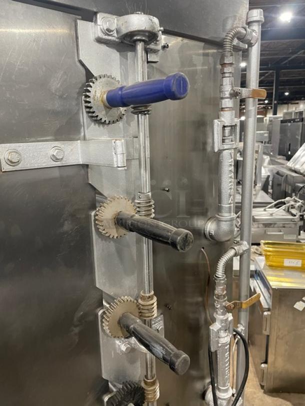 Attias stainless steel gas-powered rotisserie cabinet, features full height, commercial-grade design, and mounted on casters.