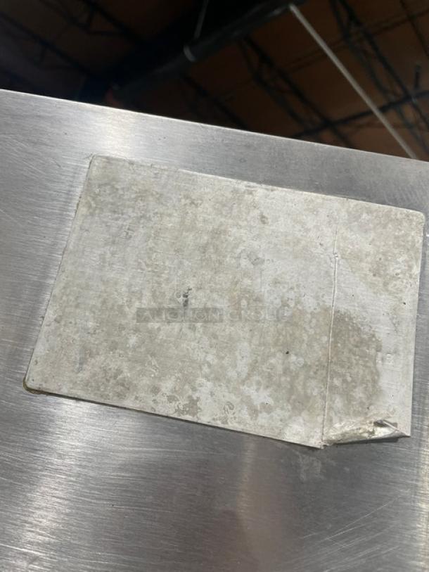 Attias stainless steel gas rotisserie cabinet on casters, full-height, commercial use. Worn label visible, indicating prior use.