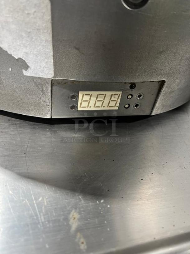 Caliente Industries Model A1 stainless steel electric tortilla press and warmer, digital display, 115-125/208-240V.