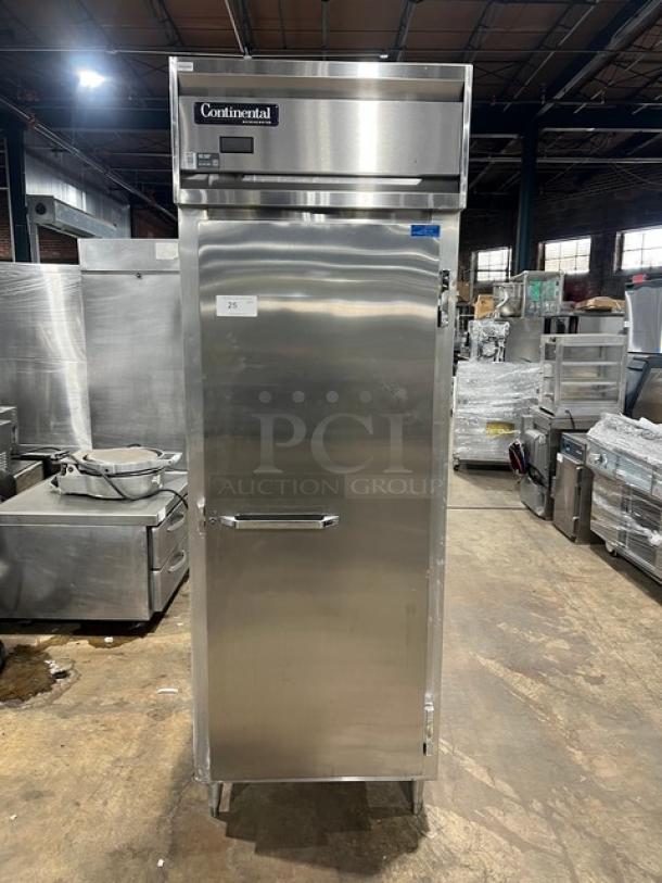Continental DL1REPT stainless steel single door reach-in pass-thru refrigerator, commercial model with pan slide, on legs, SN: 14738886.