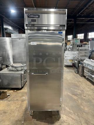 Continental DL1REPT stainless steel single door reach-in pass-thru refrigerator, commercial model with pan slide, on legs, SN: 14738886.