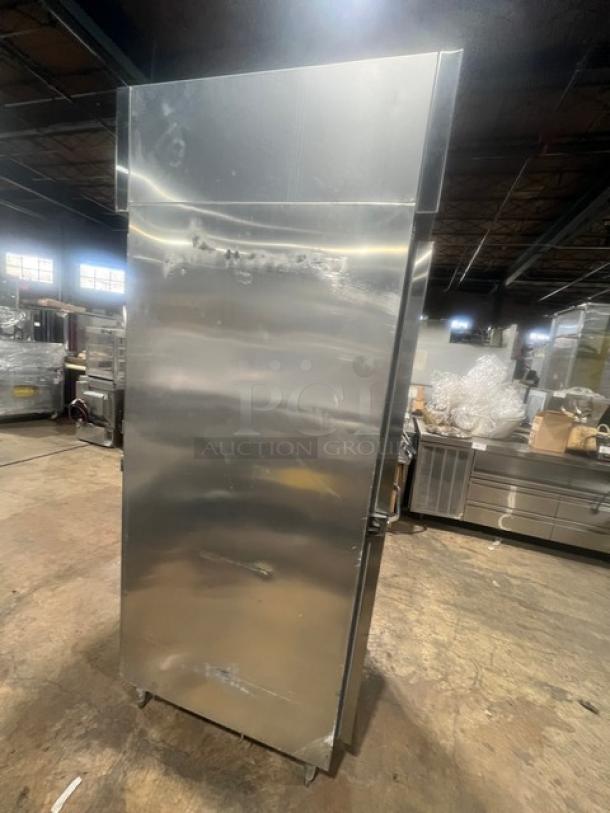 Continental DL1REPT stainless steel commercial refrigerator, single door, pass-thru, built-in pan slide, on legs, used condition.