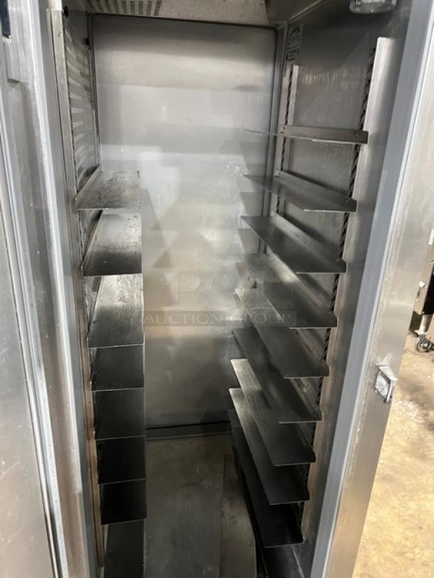 Continental DL1RE-PT stainless steel single door fridge with built-in pan slide, excellent condition, on legs, 115V.