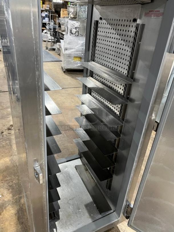 Continental DL1RE-PT stainless steel pass-thru refrigerator, single door, built-in pan slide, 115V, on legs, clean condition.