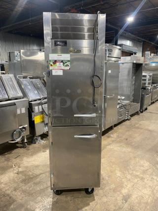 Traulsen stainless steel half door reach-in fridge, model AHT132DUTHHS, wired racks, on casters, 115V, commercial use.