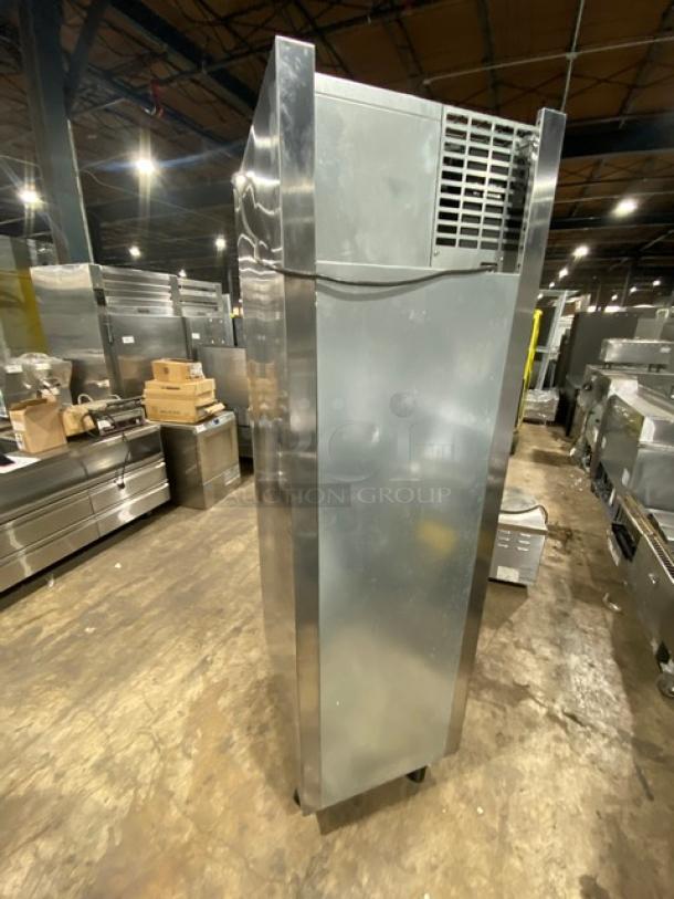 Traulsen stainless steel half door reach-in refrigerator, model AHT132DUTHHS, with wired racks and casters, single section.