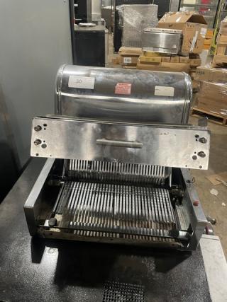 Berkel stainless steel electric countertop bread slicer, commercial-grade, used condition, visible model label and operational parts.