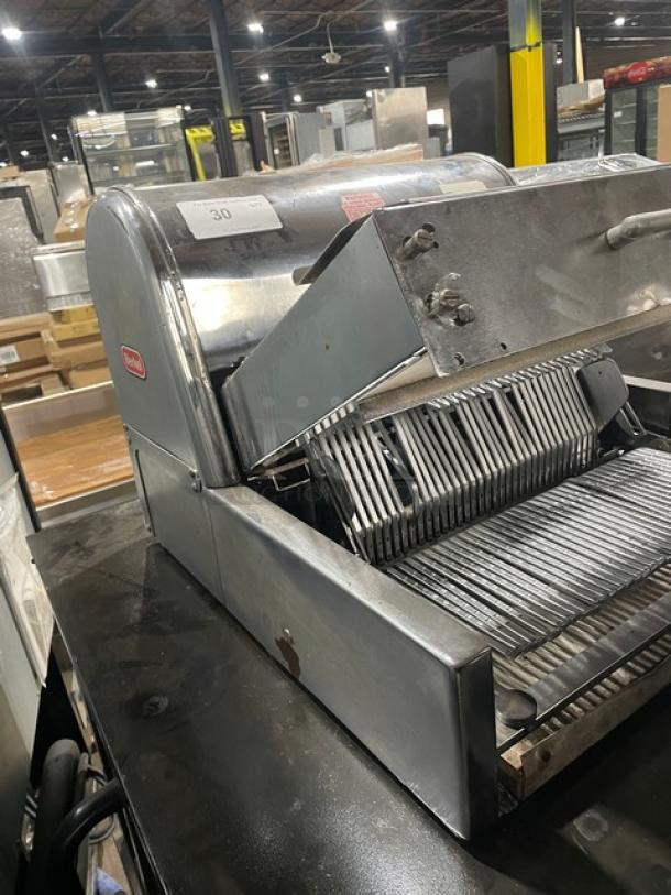 Berkel commercial stainless steel electric bread slicer, countertop, good condition, visible brand logo and model label.