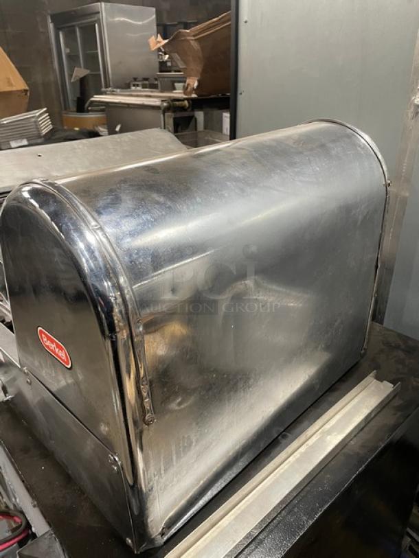 Berkel commercial stainless steel electric countertop bread slicer, sleek design, good condition, visible brand logo.