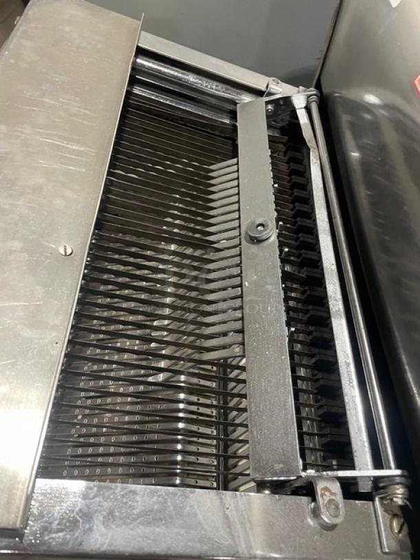 Berkel commercial stainless steel electric bread slicer, countertop model, durable blades, excellent condition.