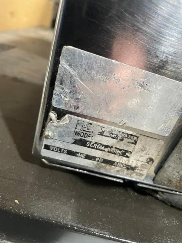 Berkel stainless steel electric countertop bread slicer, fair condition, with visible model and serial number plate.