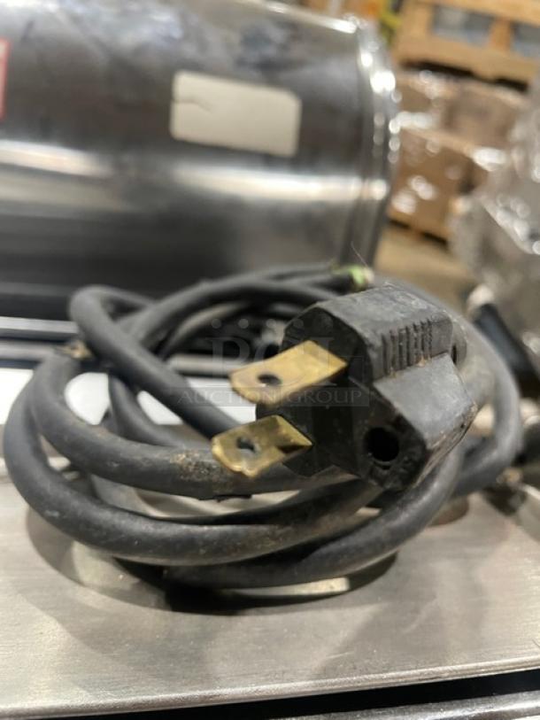 Berkel commercial stainless steel electric bread slicer, countertop model, visible power cord, used condition.