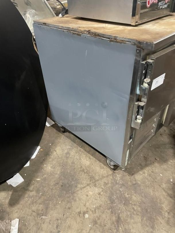 Leader Commercial Stainless Steel 2-Door Refrigerated Pizza Dough Retarder Table, Model DR48SC, on casters, visible wear.