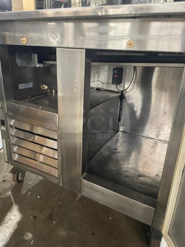 Leader DR48SC stainless steel 2-door refrigerated pizza dough retarder table in good condition, on casters, 115V, 1 phase.