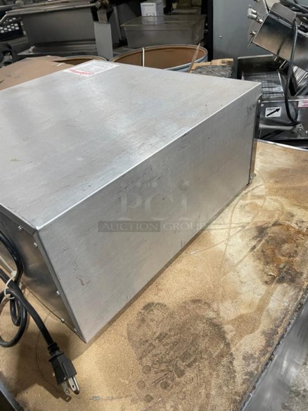 Otis Spunkmeyer OS1 stainless steel countertop convection oven, 120V, includes 3 baking trays. Model OS-1 SN: C0090295.