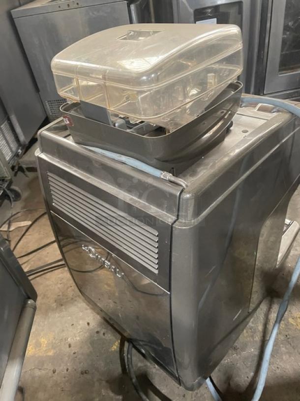 La Cimbali S39-Barsystem automatic espresso machine, stainless steel, clear polycarbonate hopper, steam wand, on legs.