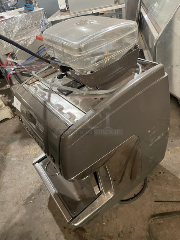 La Cimbali S39 Barsystem automatic espresso machine, stainless steel, with clear polycarbonate hopper, steam wand, on legs.