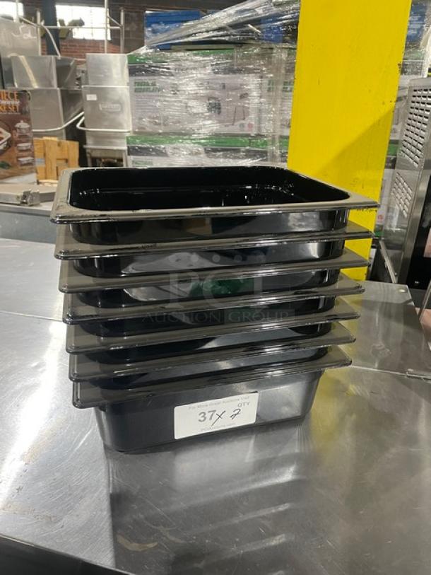 Rubbermaid Commercial black 1/2-size 4" deep insert pans, Model FG224P00BLA, stacked, new condition.