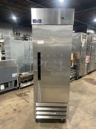 Arctic Air AR23E stainless steel single door refrigerator, Energy Star certified, with poly-coated wired rack, on casters.