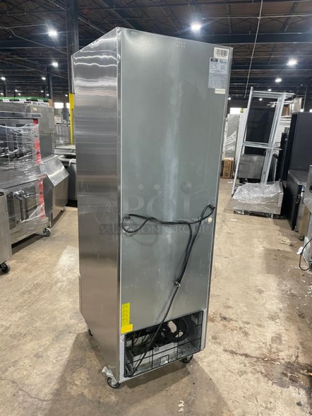 Arctic Air AR23E stainless steel single door reach-in refrigerator, Energy Star certified, on casters, visible wiring, back view.