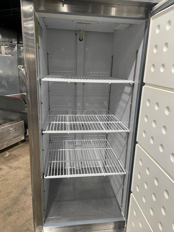 Arctic Air AR23E stainless steel single door refrigerator, Energy Star certified, with poly-coated wire racks, on casters.