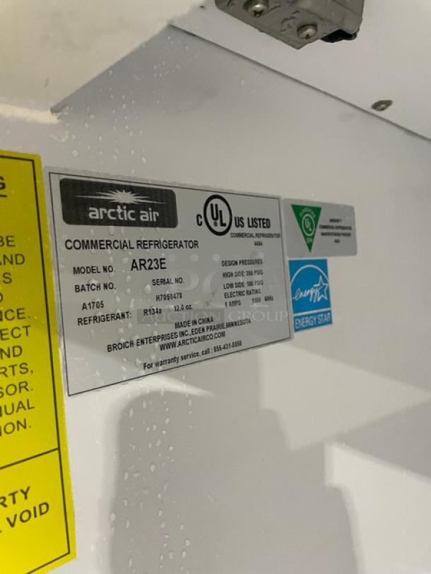 Arctic Air AR23E commercial refrigerator label, model and serial numbers visible, Energy Star certified, electrical specs listed.
