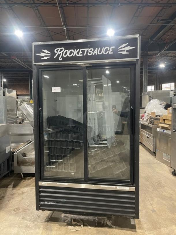 True GDM-41 commercial black double glass sliding door refrigerator with pusher glide bottle organizer, 115V, 1 Phase.