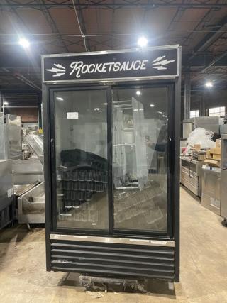 True GDM-41 commercial black double glass sliding door refrigerator with pusher glide bottle organizer, 115V, 1 Phase.