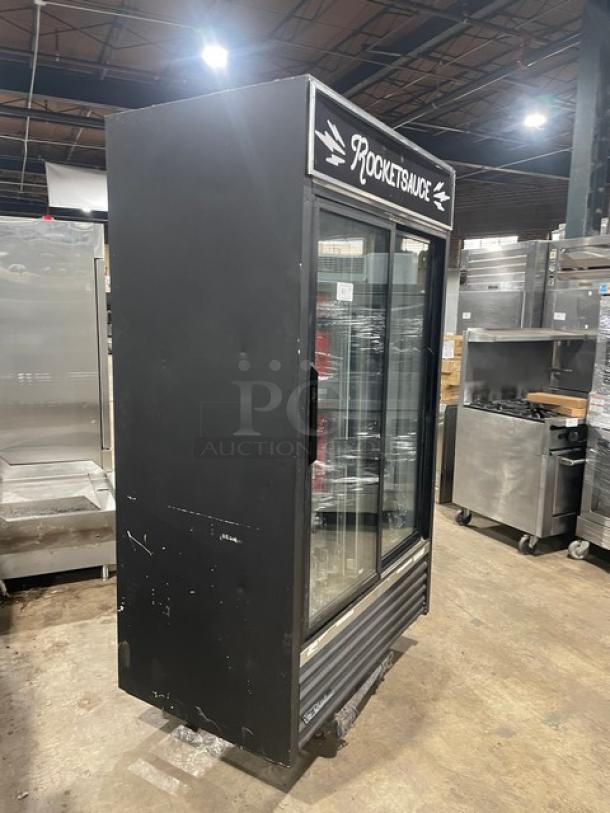 True GDM-41 commercial black double glass sliding door refrigerator with pusher glide bottle organizer. Model: GDM-41.