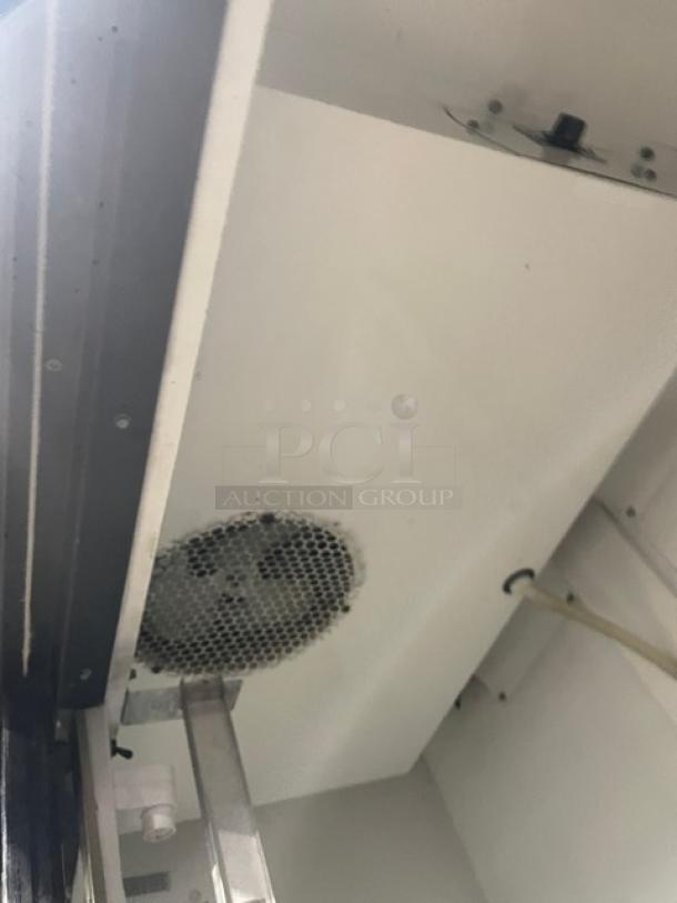 True GDM-41 black double glass sliding door refrigerator, with internal fan and pusher glide bottle organizer, gently used.