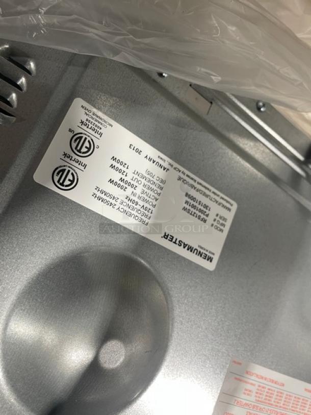 New Menumaster RFS12TSW commercial countertop microwave oven, stainless steel, digital controls, 120V, model label shown.