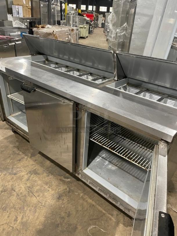 Beverage-Air Elite Series 3-door stainless steel refrigerated prep table, Model SPE72-18, with poly-coated rack, on casters.