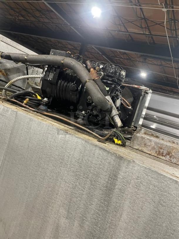 Traulsen G31010 stainless steel commercial triple door freezer, Energy Star certified, with poly coated rack, on casters.